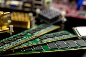 Detailed view of RAM sticks and microprocessors on a motherboard.